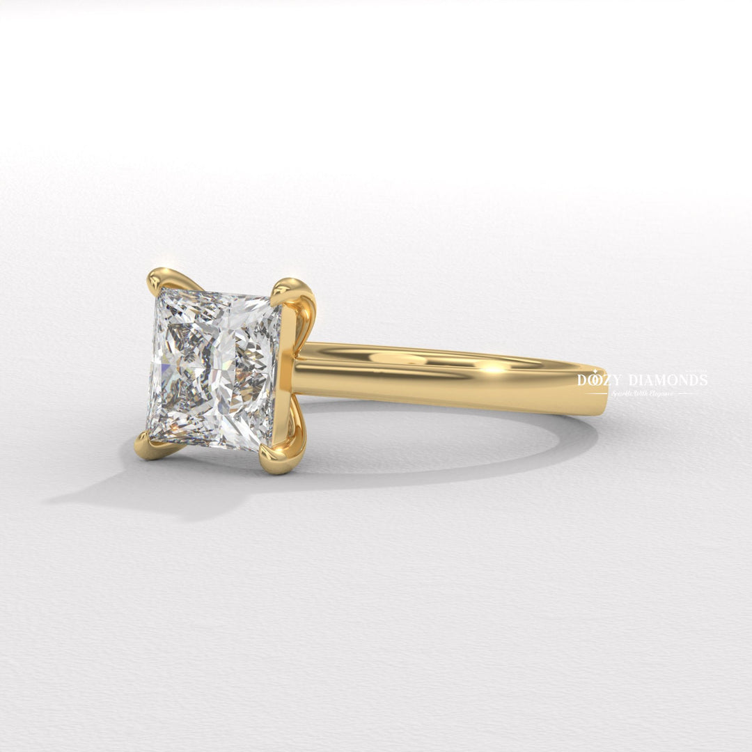 Princess cut engagement ring shown with authenticity certificate