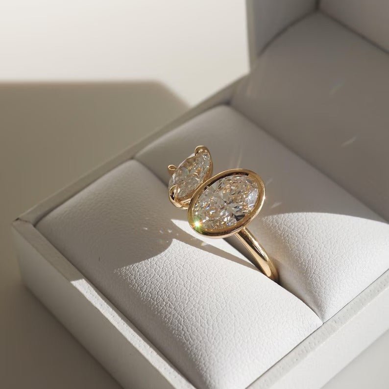 Oval cut bezel engagement ring shown in real-life wear