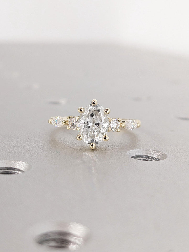 1.0CT oval cut cluster engagement ring available to buy now