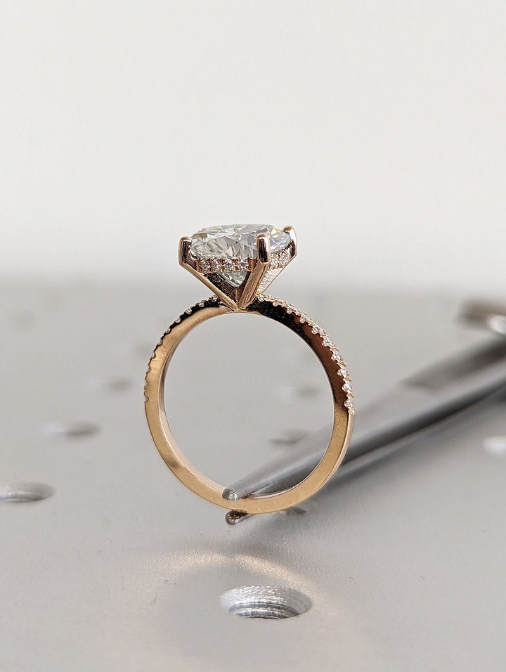 Round cut engagement ring side view showing band detail