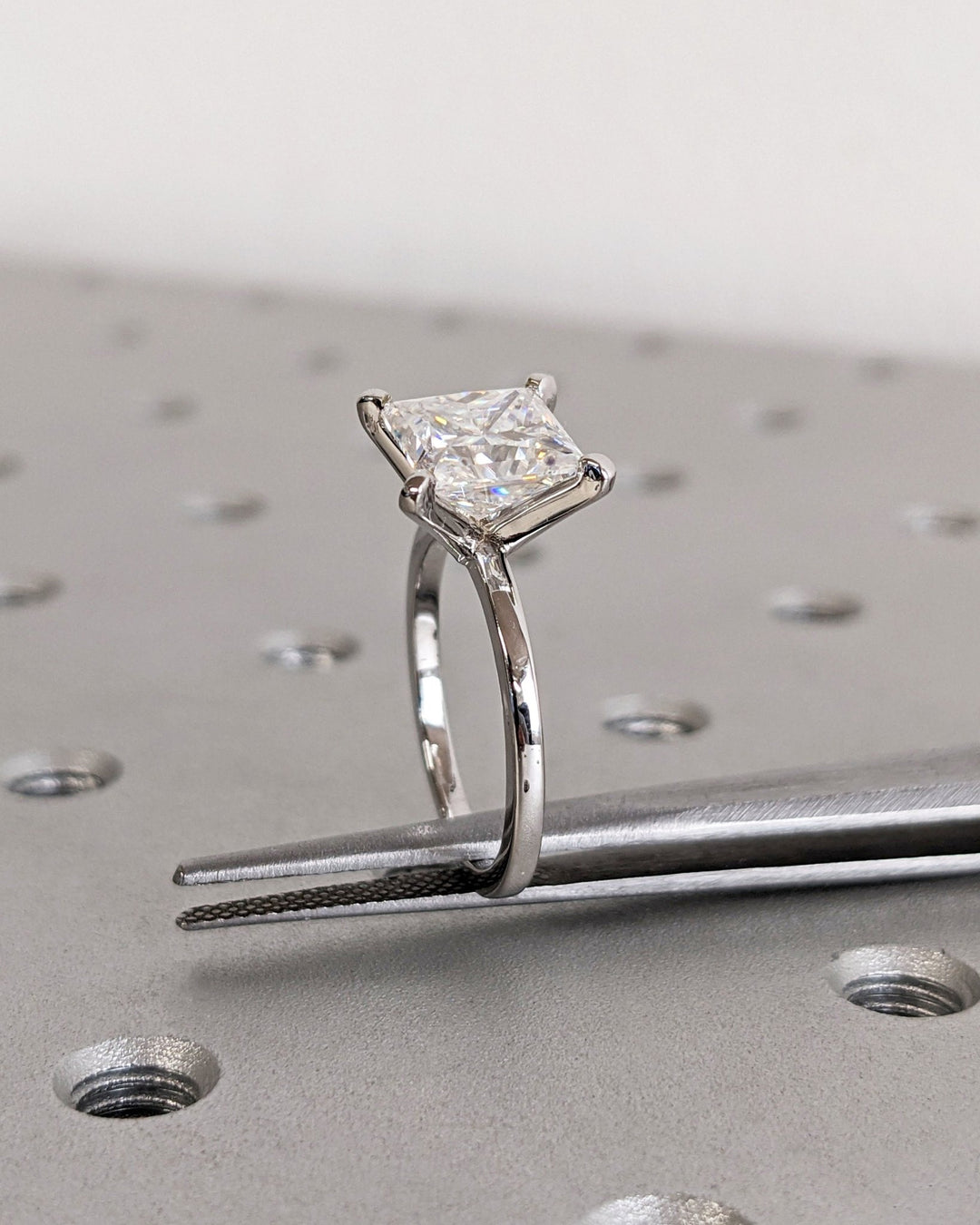Princess solitaire diamond ring presented in signature gift packaging