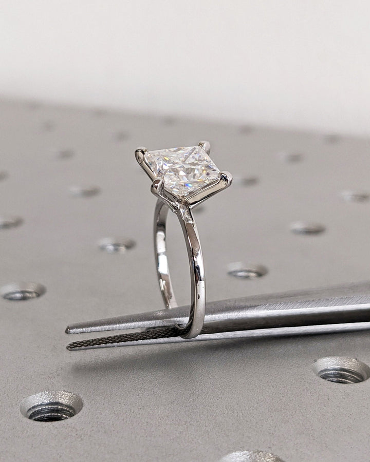 Princess solitaire diamond ring presented in signature gift packaging