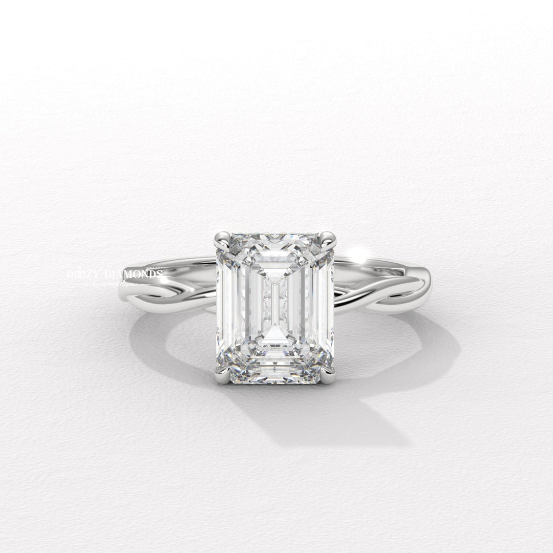 Fine craftsmanship detail on emerald solitaire engagement ring