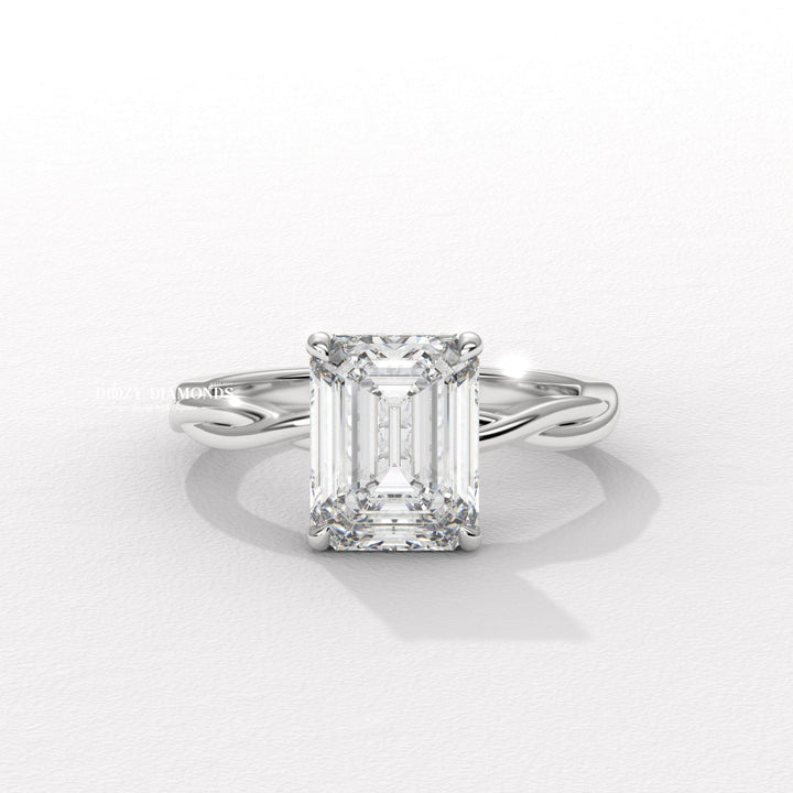 Fine craftsmanship detail on emerald solitaire engagement ring