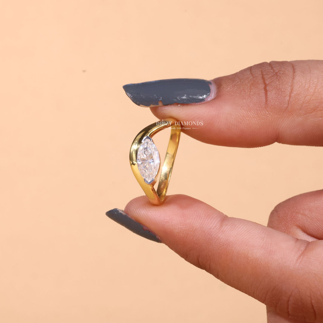Unboxing view of marquise cut solitaire diamond engagement ring