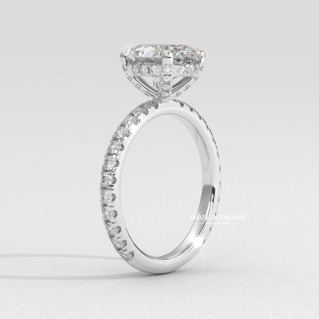 Side angle of oval hidden halo diamond engagement ring