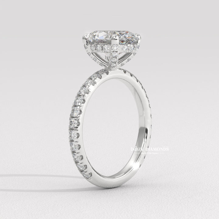 Side angle of oval hidden halo diamond engagement ring