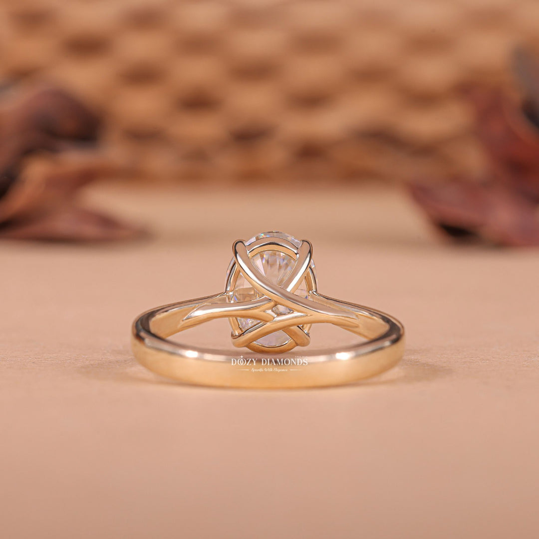 Detailed close-up of oval solitaire diamond engagement ring