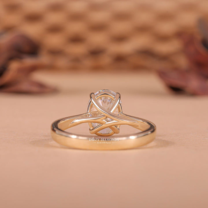 Detailed close-up of oval solitaire diamond engagement ring