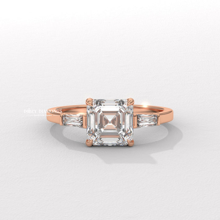 Asscher three stone engagement ring shown on hand for true-to-life sizing
