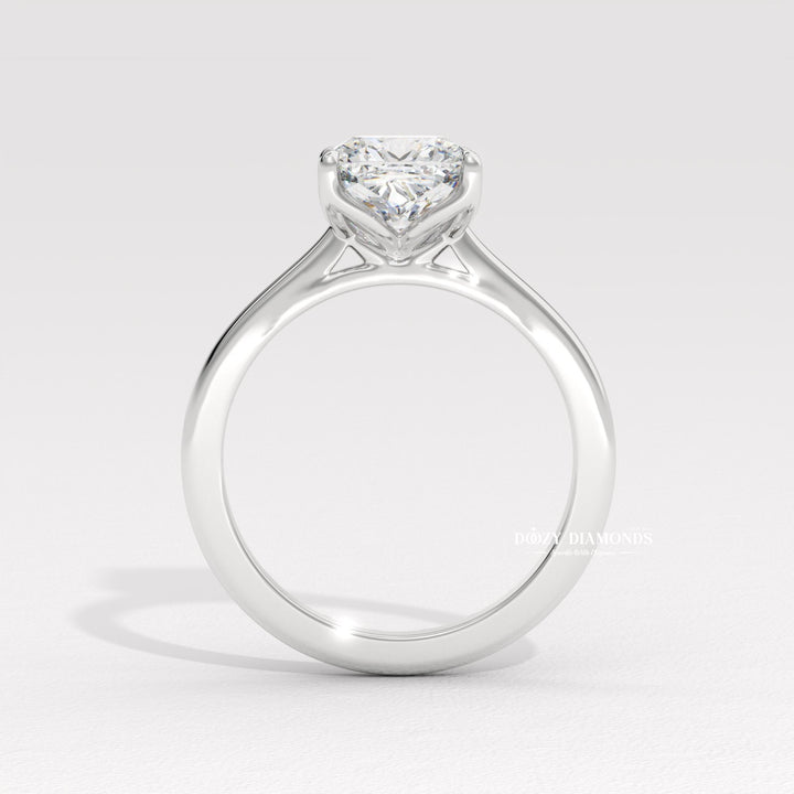 Close-up of cushion cut center diamond in solitaire engagement ring