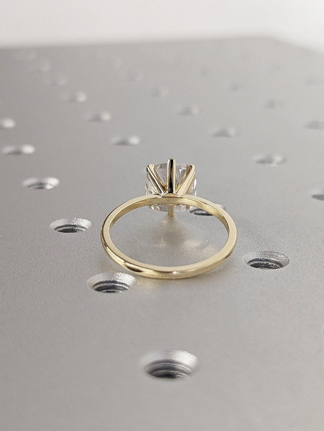 Certified cushion cut diamond featured in solitaire engagement ring