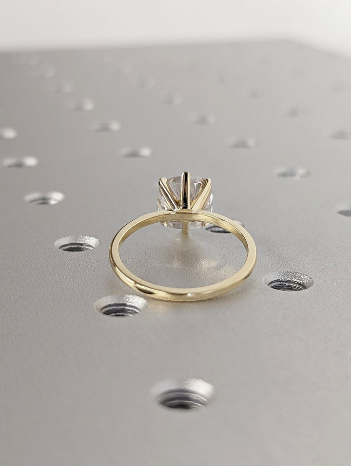 Certified cushion cut diamond featured in solitaire engagement ring