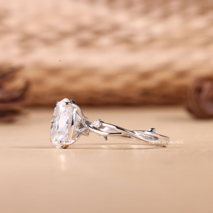 Oval solitaire engagement ring close-up showing E/VS1 diamond clarity