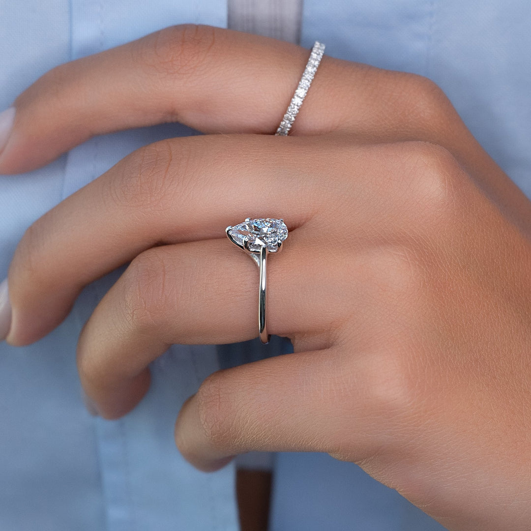 Detailed close-up of pear solitaire diamond engagement ring