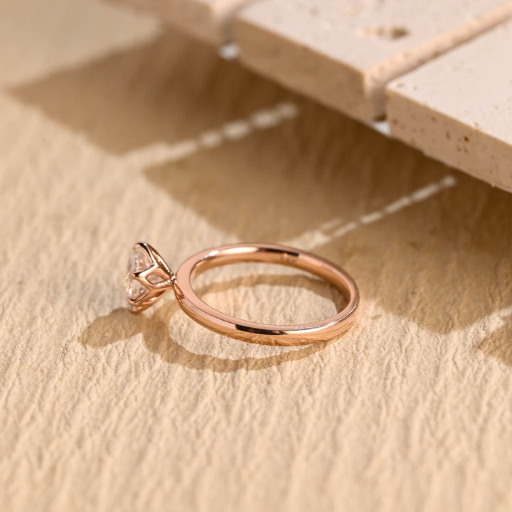 Detailed close-up of oval solitaire diamond engagement ring
