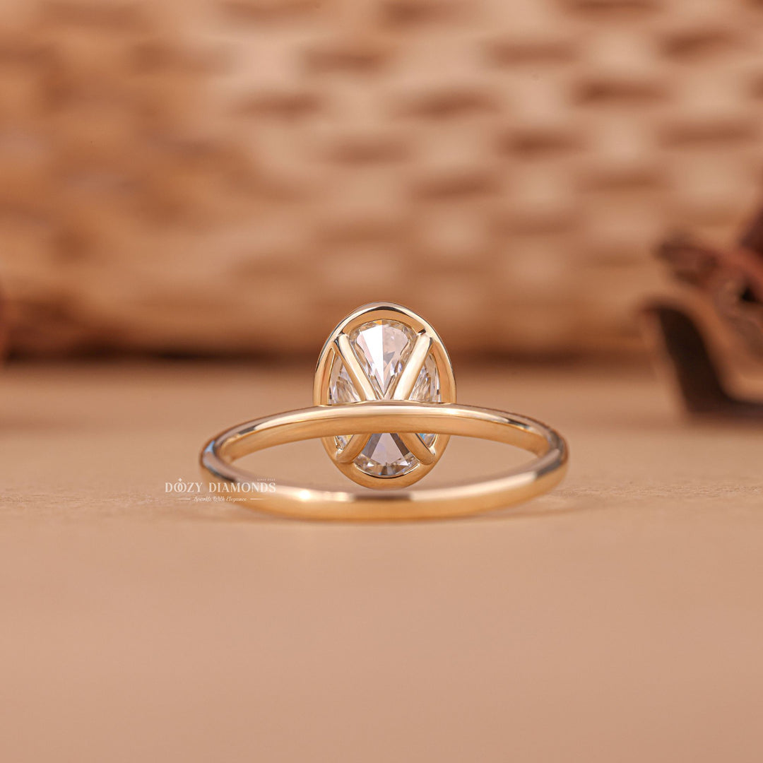 Unboxing view of oval cut bezel diamond engagement ring