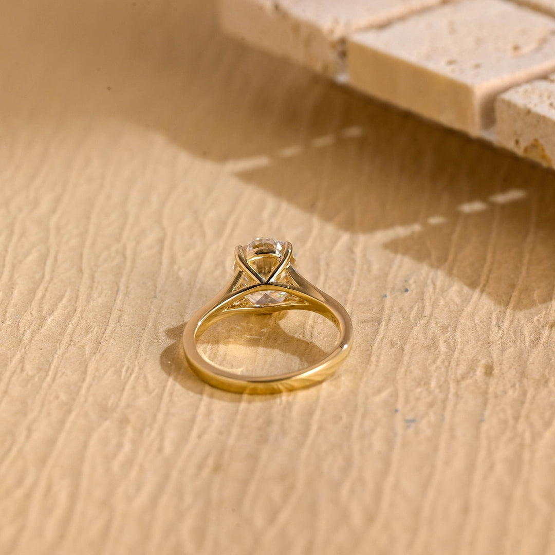 Macro shot of oval cut diamond facets in split shank ring setting