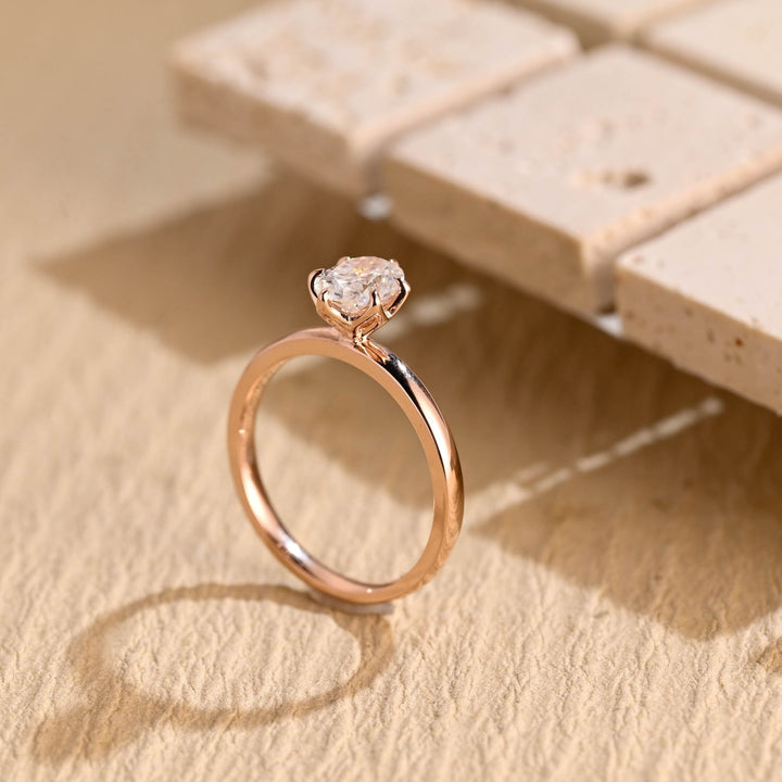 Oval solitaire lab grown diamond ring side profile in gold setting