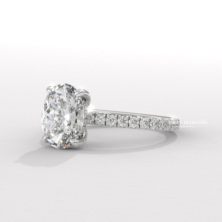 Oval hidden halo lab grown diamond ring in jewelry gift box