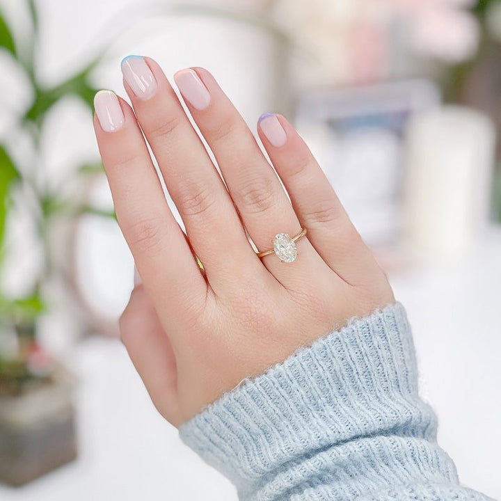 Certified oval cut diamond featured in solitaire engagement ring