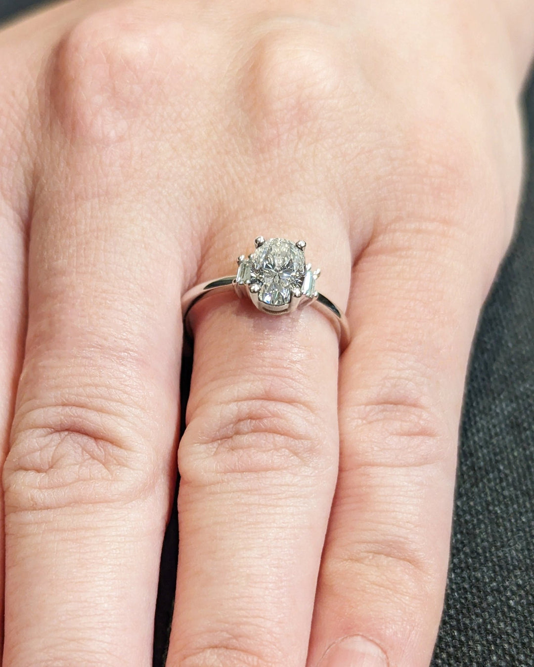 Macro shot of oval cut diamond facets in solitaire ring setting