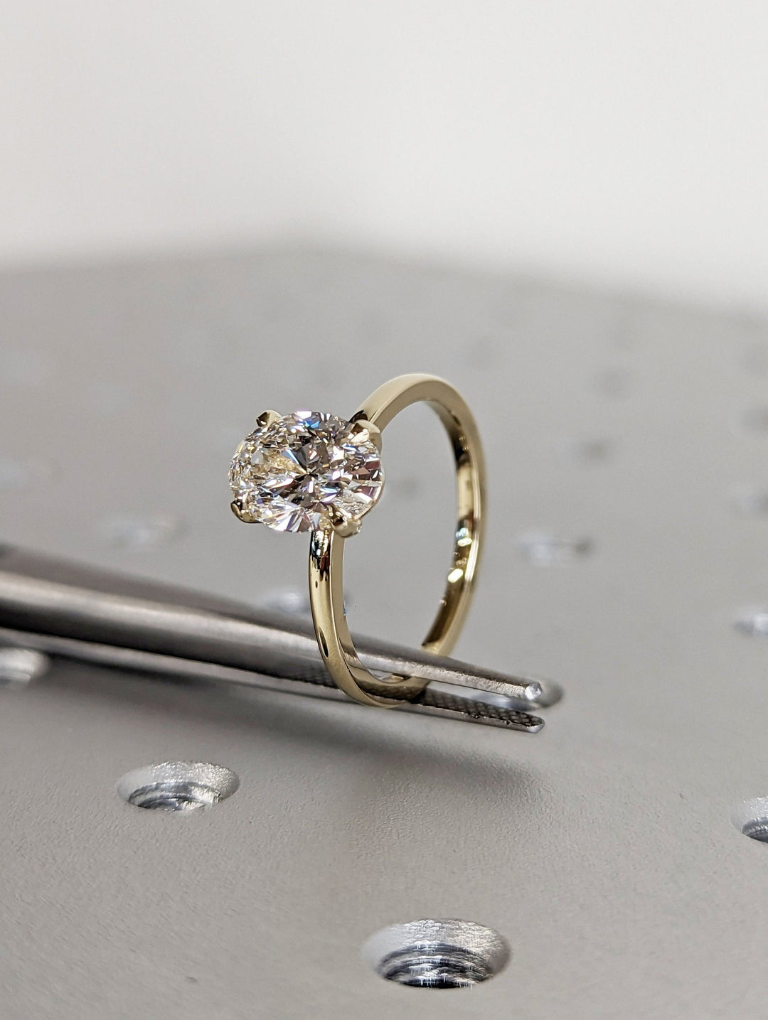 Oval solitaire engagement ring with certified lab grown diamond