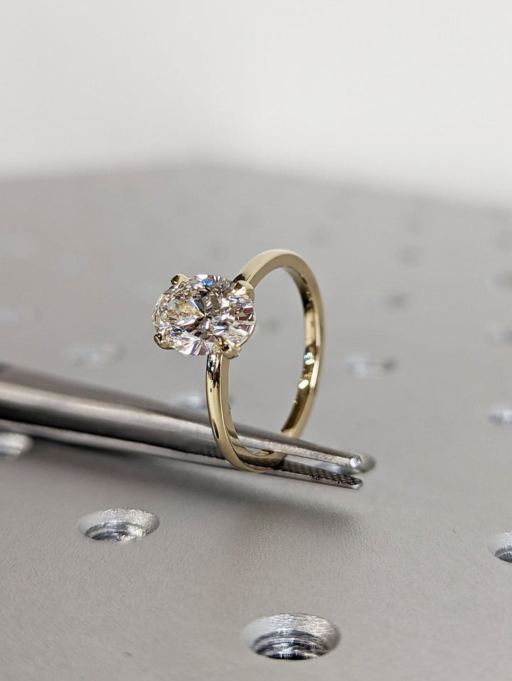 Oval solitaire engagement ring with certified lab grown diamond