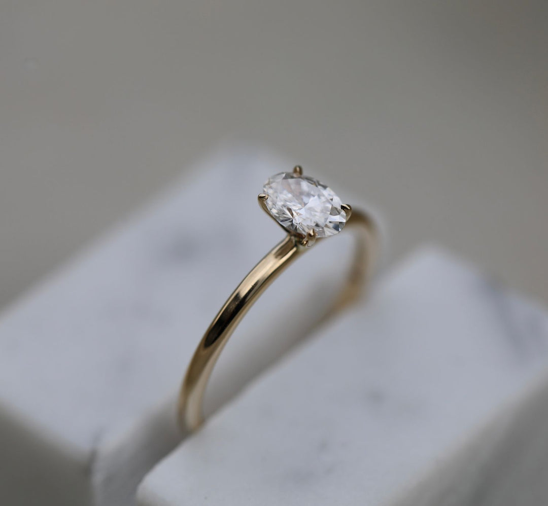Fine craftsmanship detail on oval solitaire engagement ring