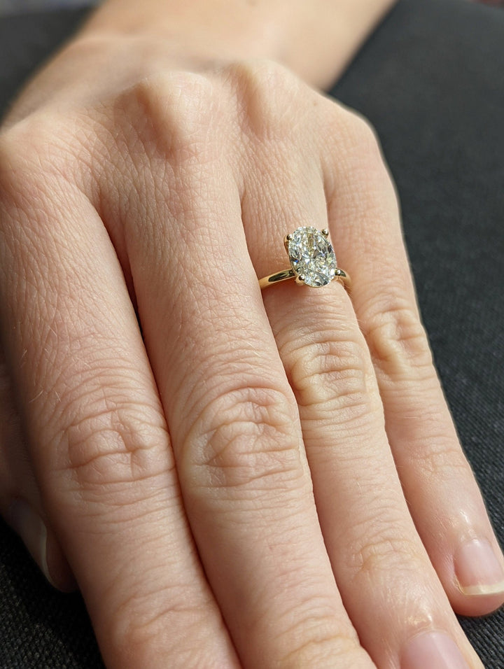 Oval solitaire engagement ring offered in gold and platinum