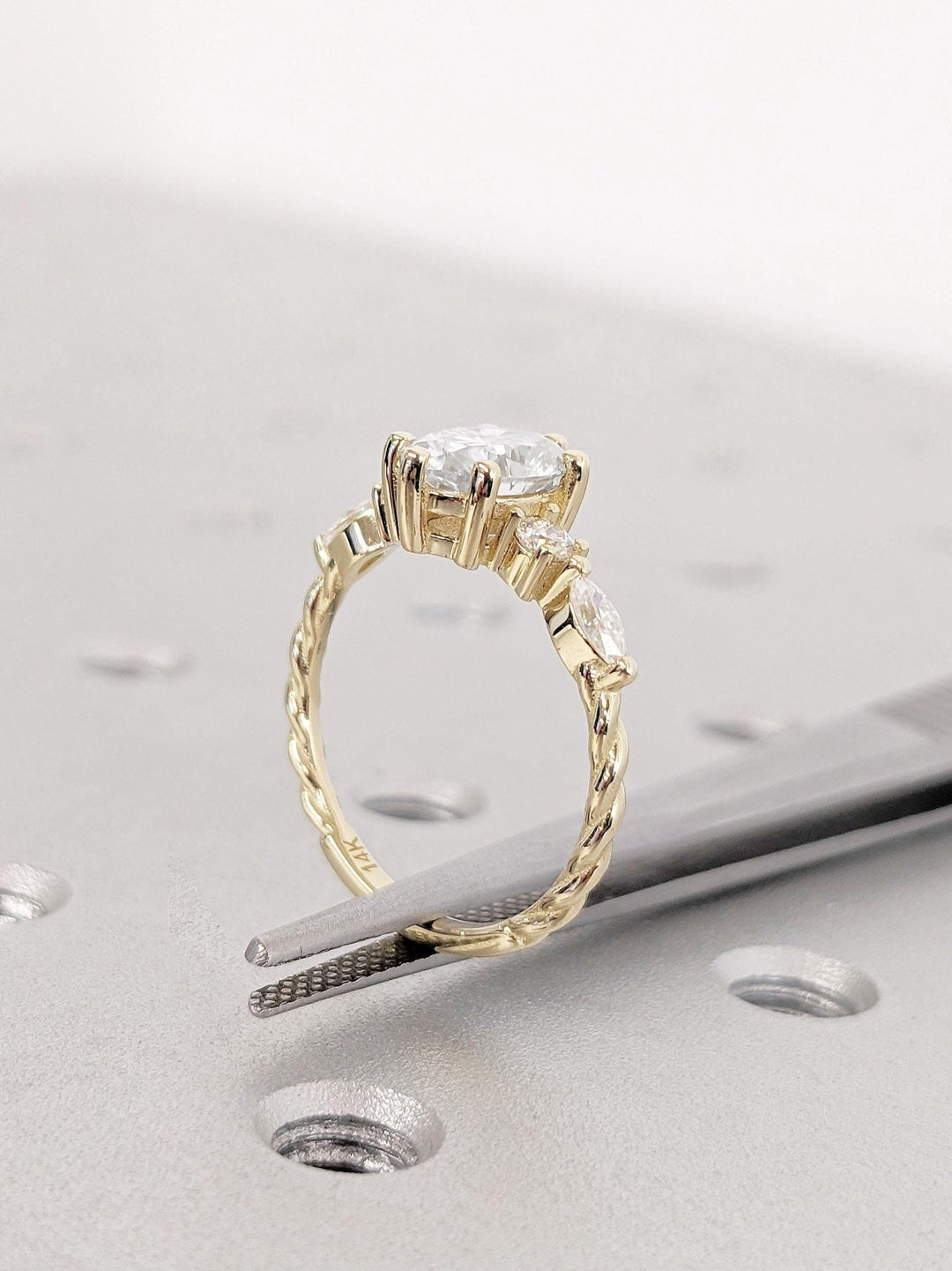 Oval cut diamond ring worn on hand