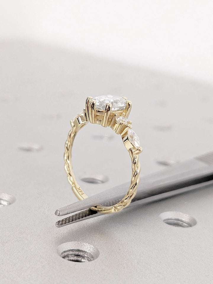 Side angle of oval cluster diamond engagement ring