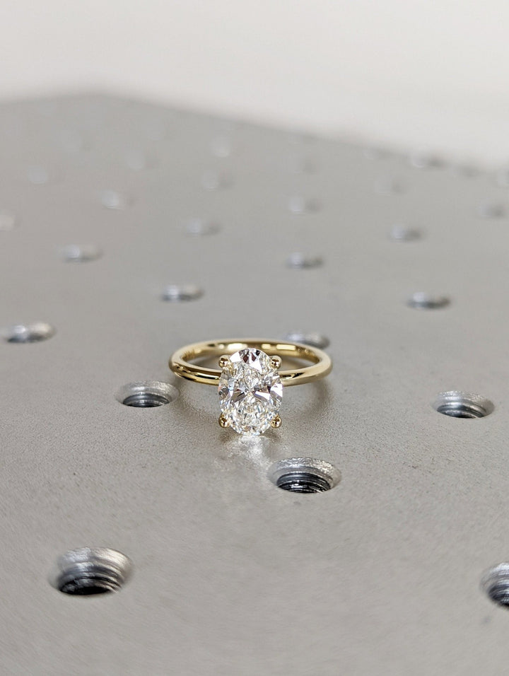 Oval solitaire ring set with an IGI graded diamond