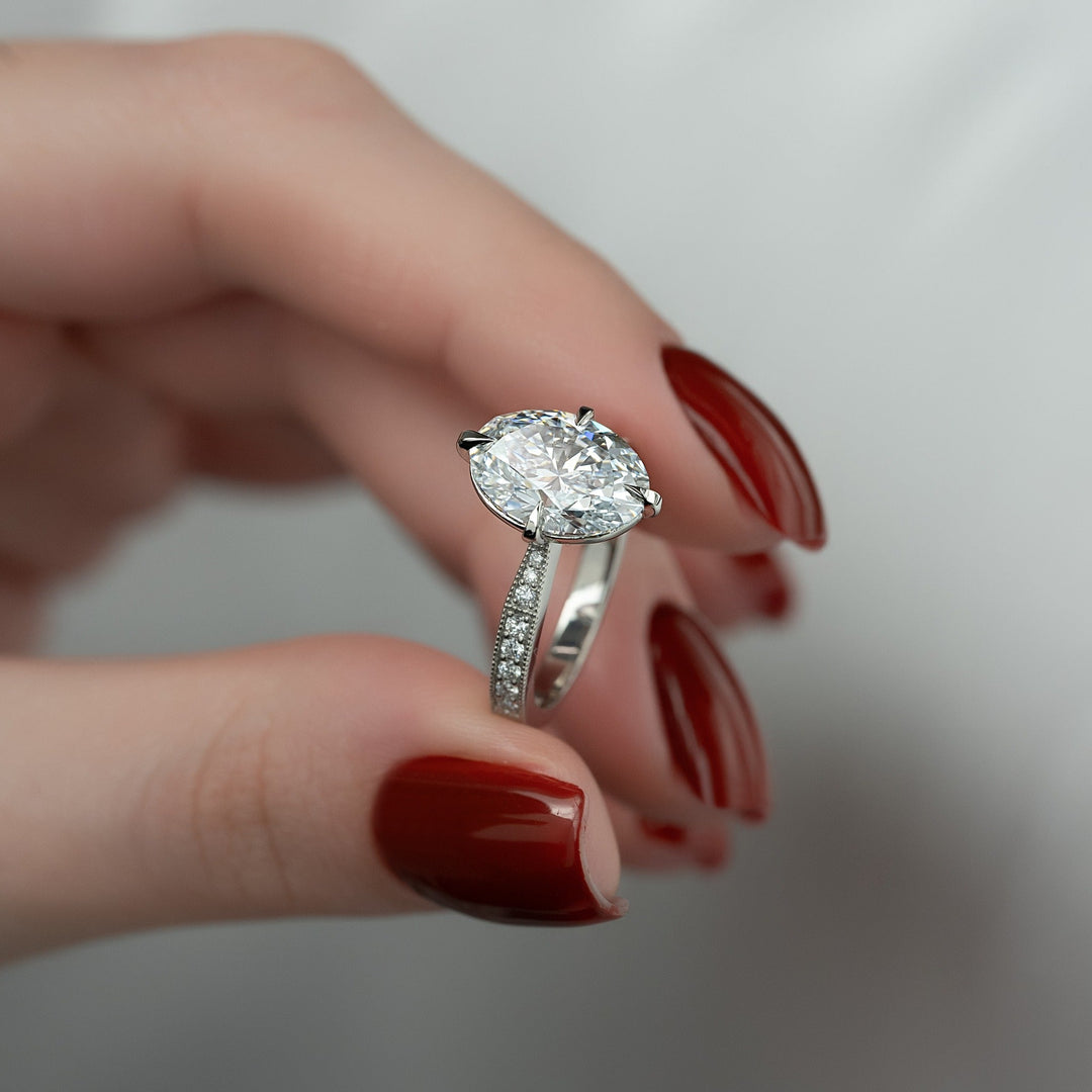 IGI certified oval cut diamond in hidden halo engagement ring setting