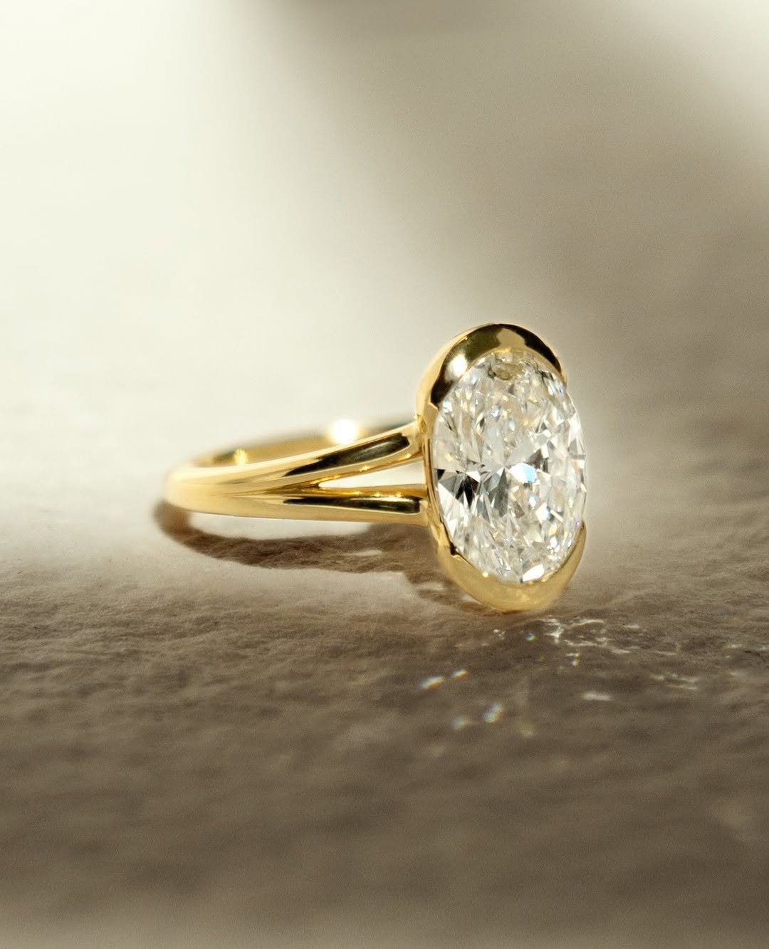 Top-down view of oval cut bezel engagement ring