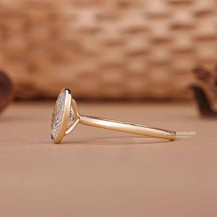 Oval bezel lab grown diamond ring in jewelry gift box