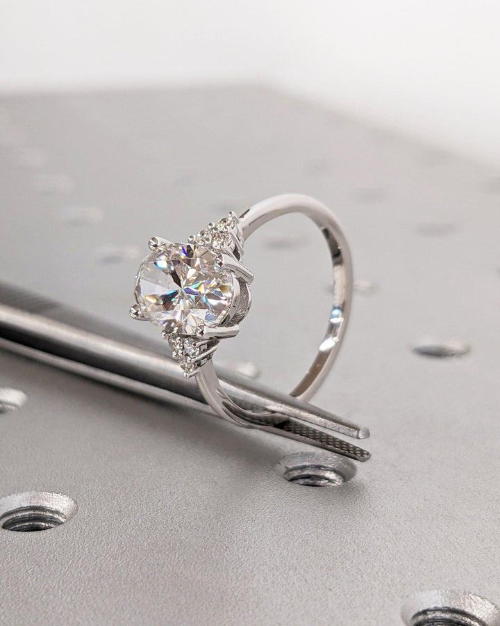 Oval cluster lab grown diamond ring side profile in gold setting