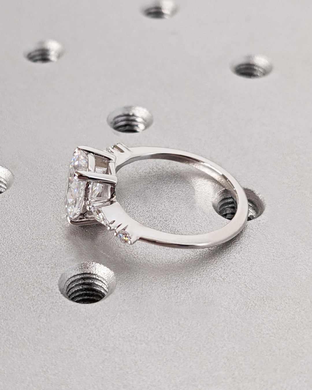 Oval cluster diamond engagement ring available in multiple metals