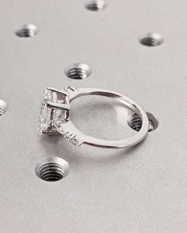 Oval cluster diamond engagement ring available in multiple metals