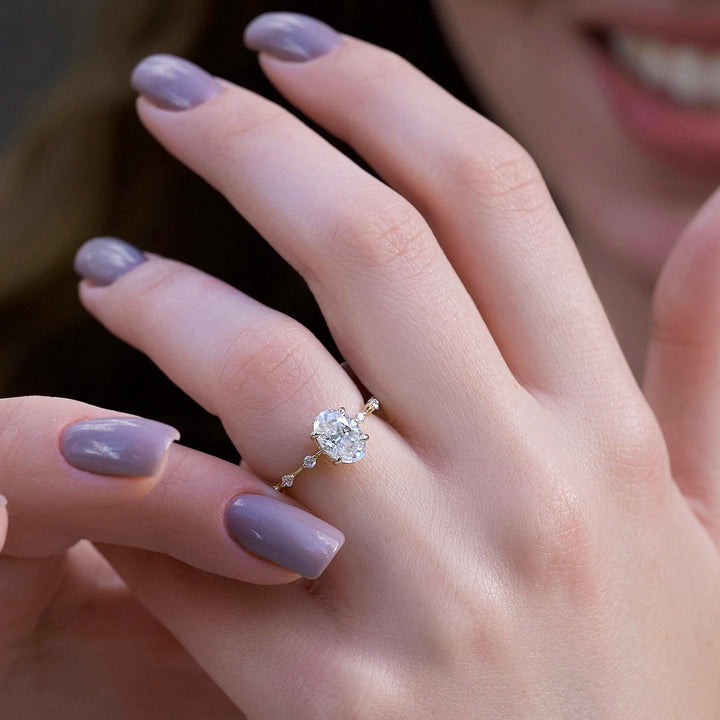 Oval cut engagement ring shown with authenticity certificate