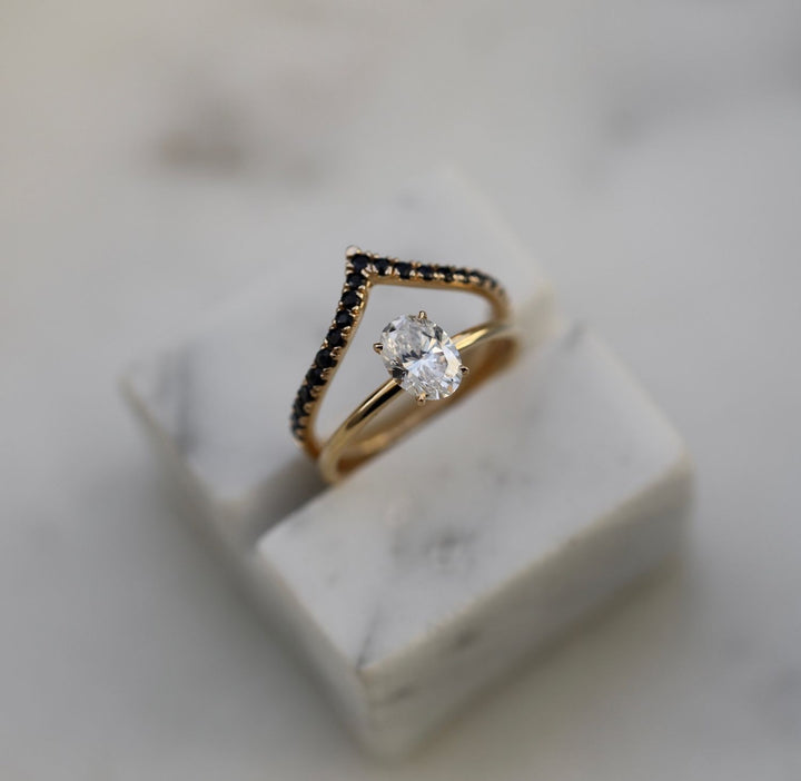 Close-up of oval cut center diamond in solitaire engagement ring