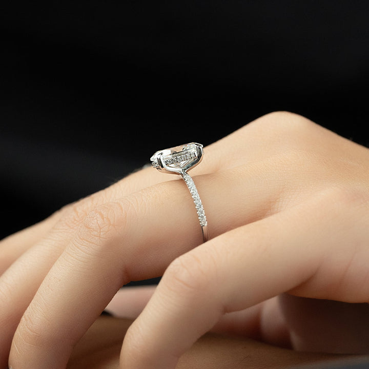 Side angle of oval hidden halo diamond engagement ring
