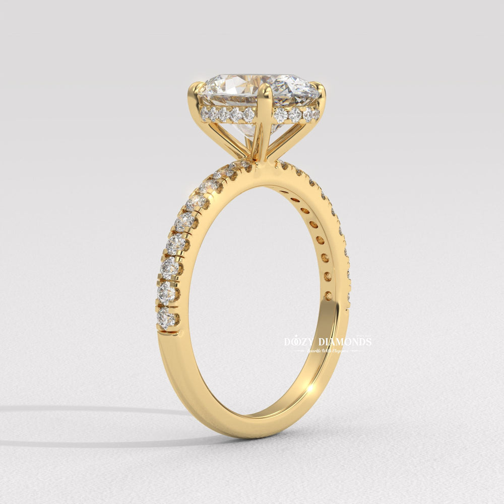 Close-up of oval cut center diamond in hidden halo engagement ring