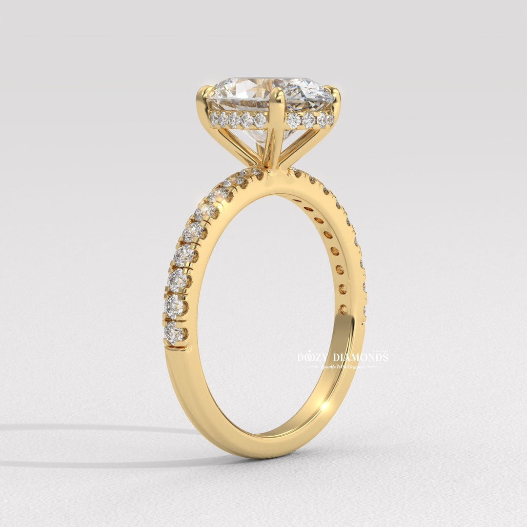 Close-up of oval cut center diamond in hidden halo engagement ring