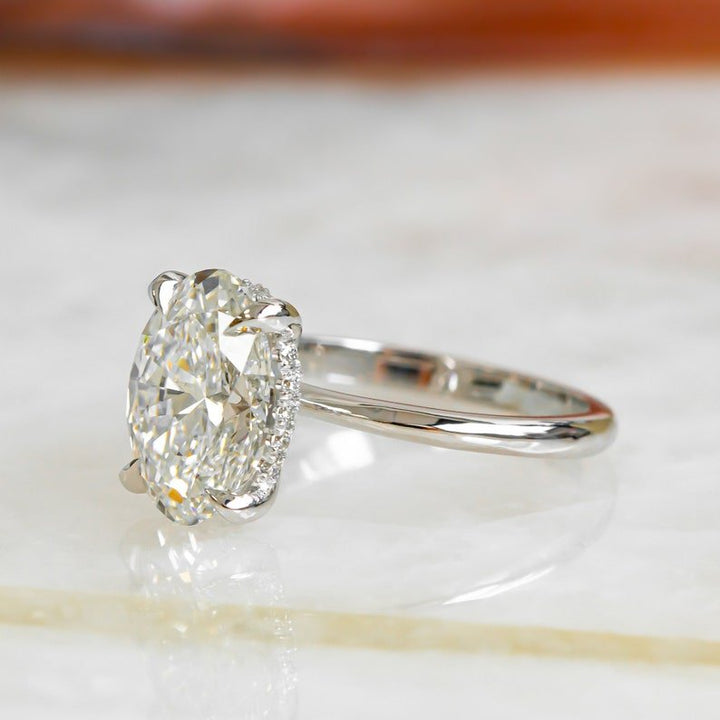 Classic oval hidden halo engagement ring crafted for everyday wear