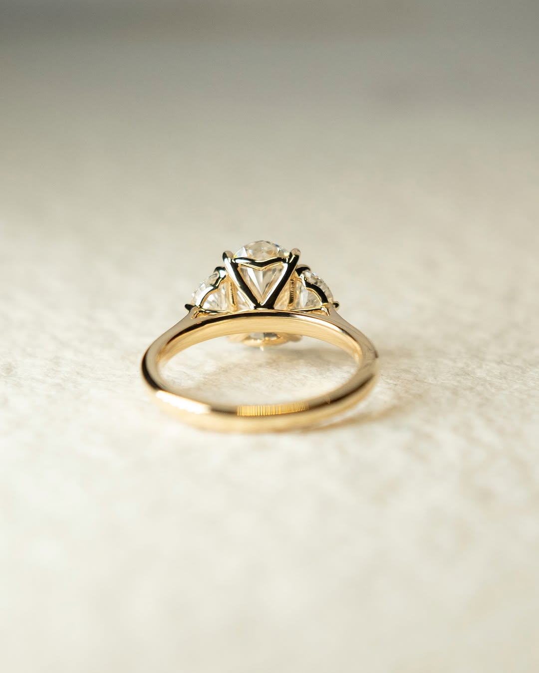 Classic oval three stone engagement ring crafted for everyday wear
