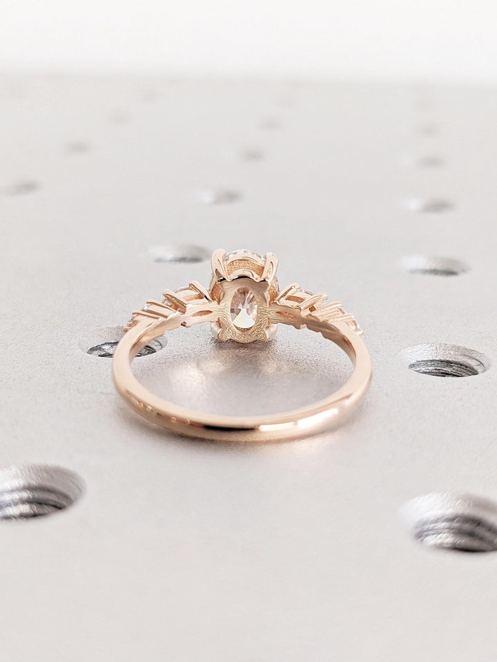 Top-down view of oval cut cluster engagement ring