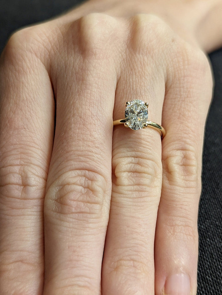IGI certified oval cut diamond in solitaire engagement ring setting