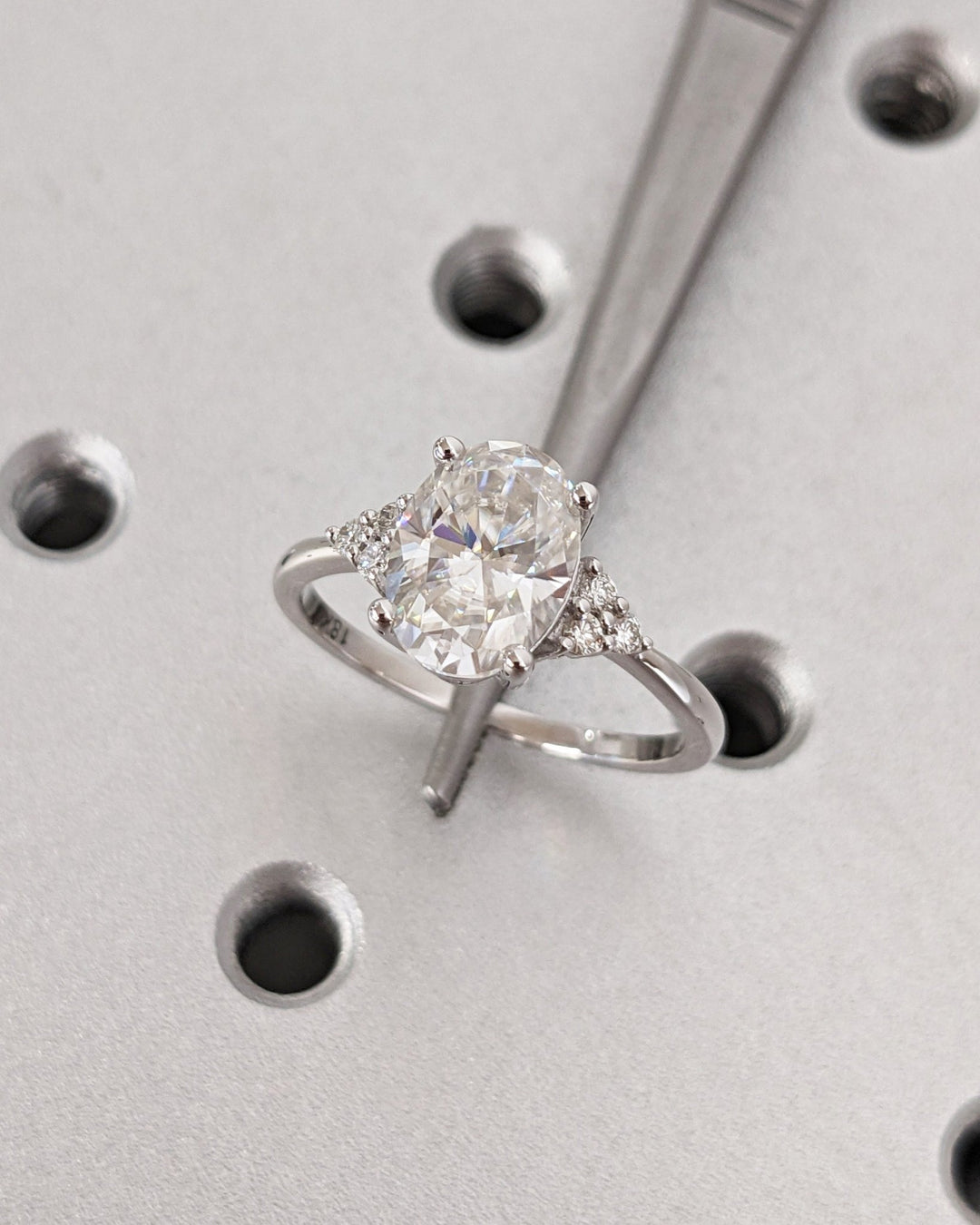 Oval cut engagement ring side view showing band detail