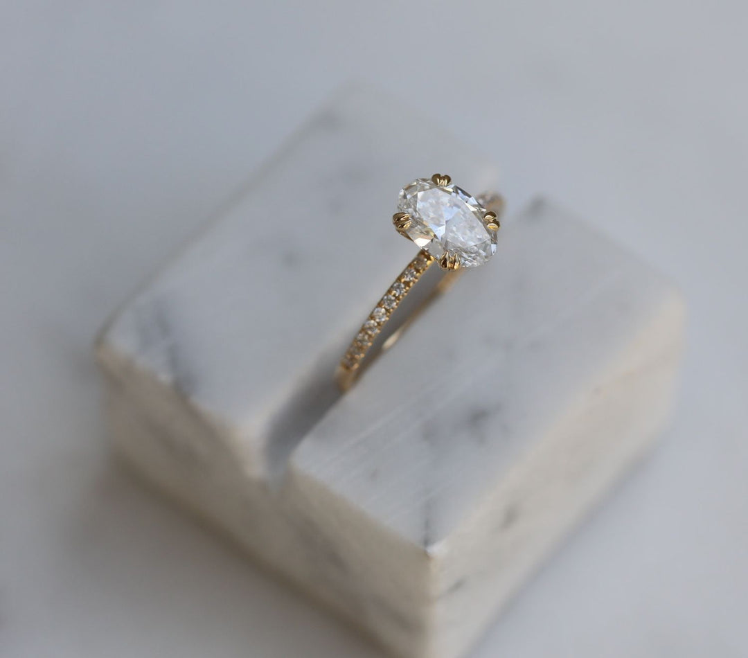 Oval solitaire lab grown diamond ring side profile in gold setting